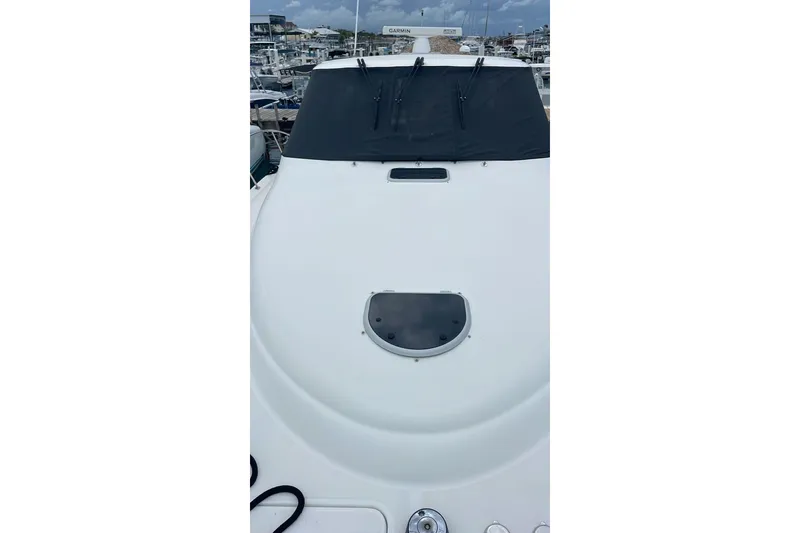 Slide: The Image of 2009 Tiara Yachts 3900 Sovran yacht deck with covered windshield in marina. - 23