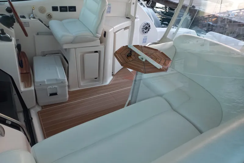 Slide: The Image of 2009 Tiara Yachts 3900 Sovran interior with white seating and wooden accents. - 37