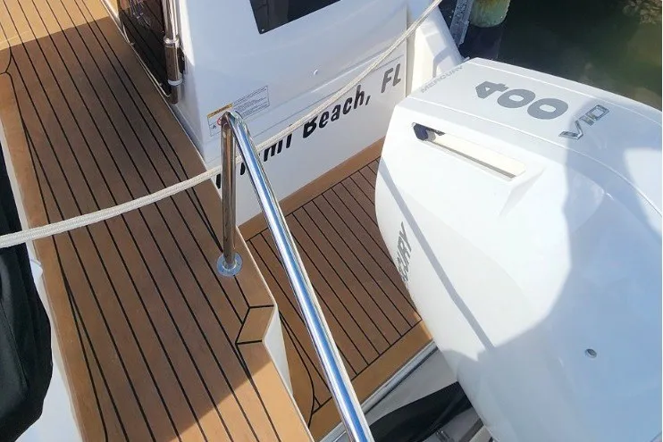 Slide: The Image of 2024 Aquila 36 Sport boat with teak deck and powerful outboard engine in Miami Beach, FL. - 24