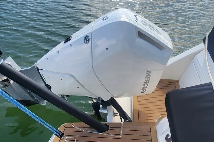 Slide: The Image of 2024 Aquila 36 Sport boat with Mercury outboard engine on water. - 23