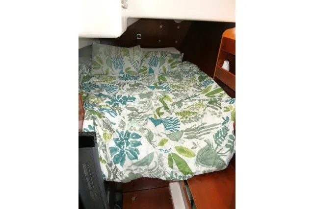 Slide: The Image of Cozy cabin bed with floral bedding in 1999 Beneteau 411 sailboat. - 27