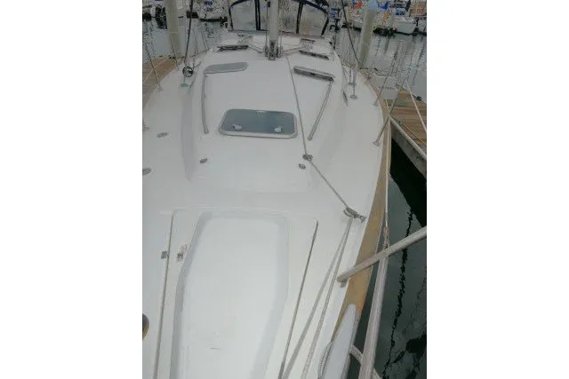 Slide: The Image of 1999 Beneteau 411 sailboat deck view at marina. - 64