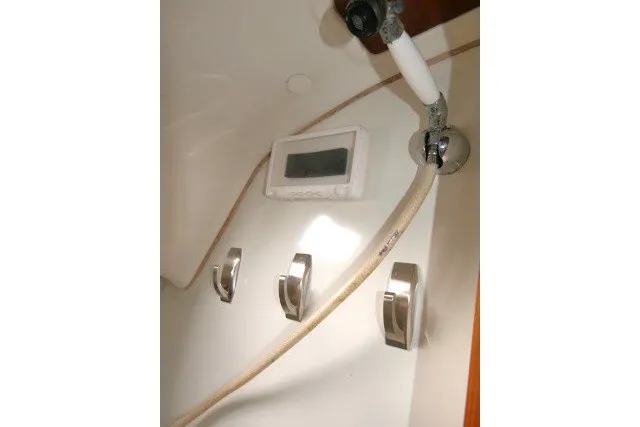 Slide: The Image of Shower controls and hose in 1999 Beneteau 411 yacht bathroom. - 31