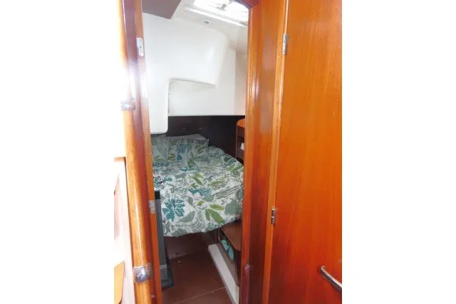 Slide: The Image of Cozy cabin interior of 1999 Beneteau 411 sailboat with floral bedding. - 26