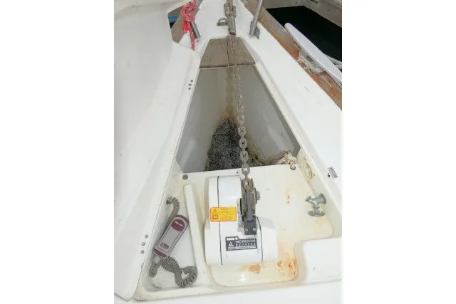Slide: The Image of Anchor chain compartment on a 1999 Beneteau 411 sailboat. - 62