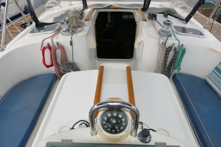 Slide: The Image of Cockpit of 1999 Beneteau 411 sailboat with compass and ropes. - 53