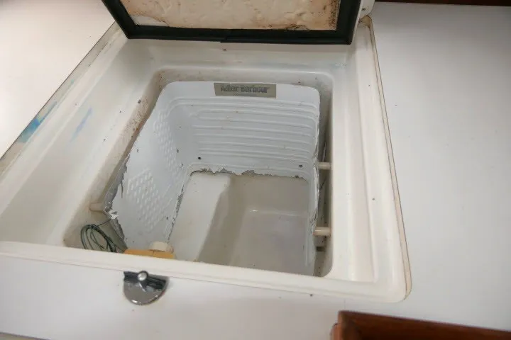 Slide: The Image of Built-in cooler on 1999 Beneteau 411 sailboat, open lid, white interior. - 18