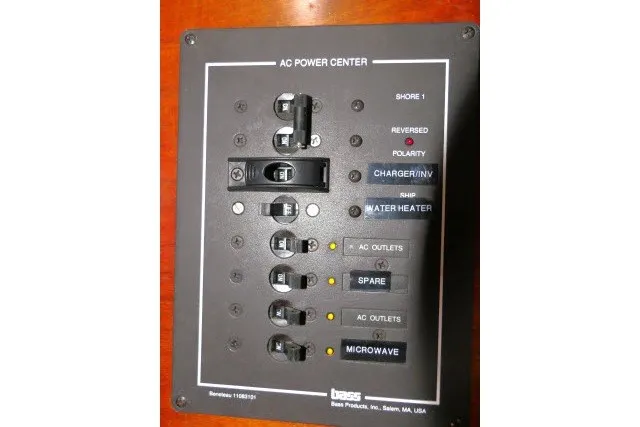 Slide: The Image of AC power center panel on a 1999 Beneteau 411 sailboat. - 24