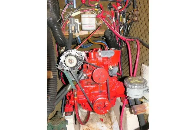 Slide: The Image of Engine compartment of a 1999 Beneteau 411 sailboat with visible wiring and components. - 65