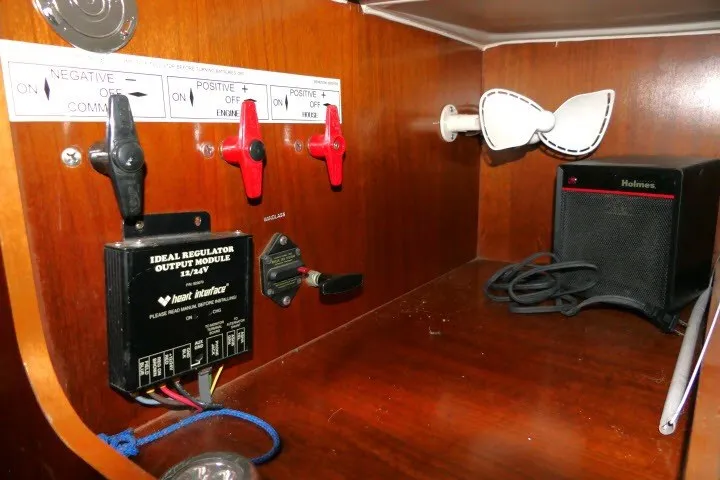 Slide: The Image of Electrical panel on a 1999 Beneteau 411 sailboat with switches and regulator module. - 25