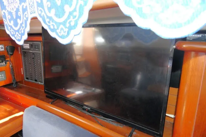 Slide: The Image of Interior of 1999 Beneteau 411 yacht with TV and control panel. - 13