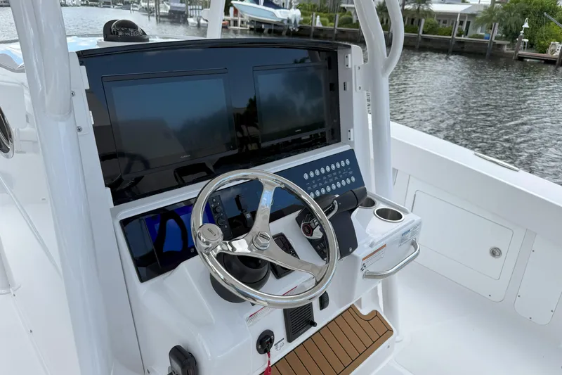 Slide: The Image of 2026 Southport 30 FE boat helm with modern controls and dual screens. - 13