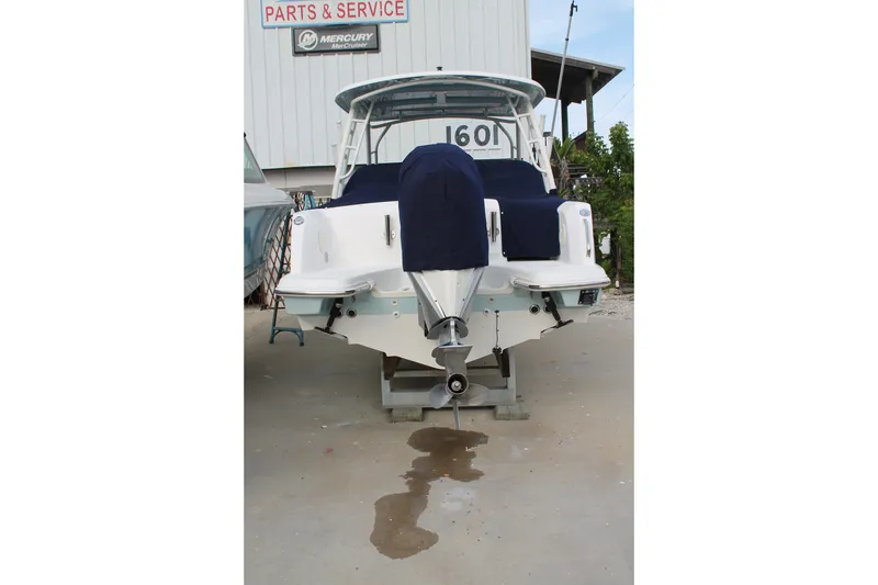 Slide: The Image of 2020 Boston Whaler 230 Vantage boat at service center, rear view. - 3