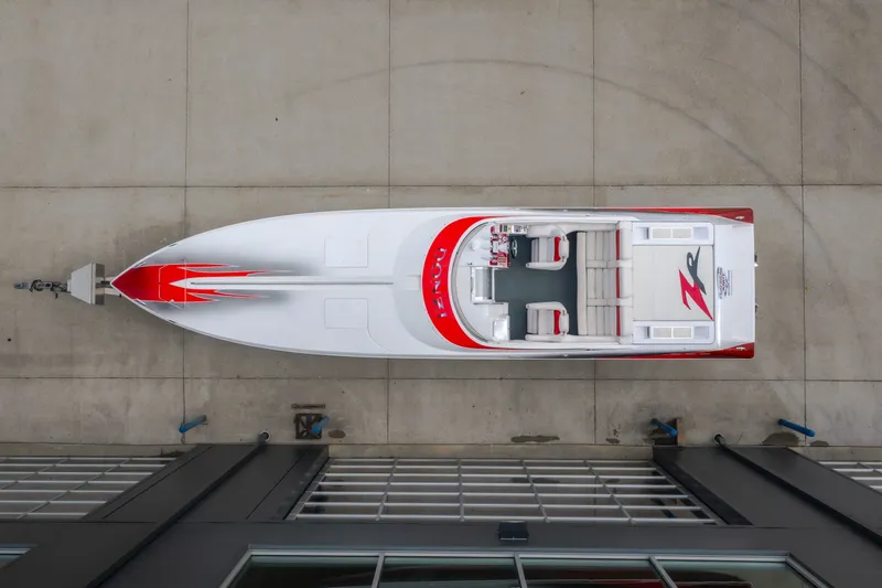 Slide: The Image of Overhead view of a 2005 Donzi 35 ZR speedboat with red and white design. - 5