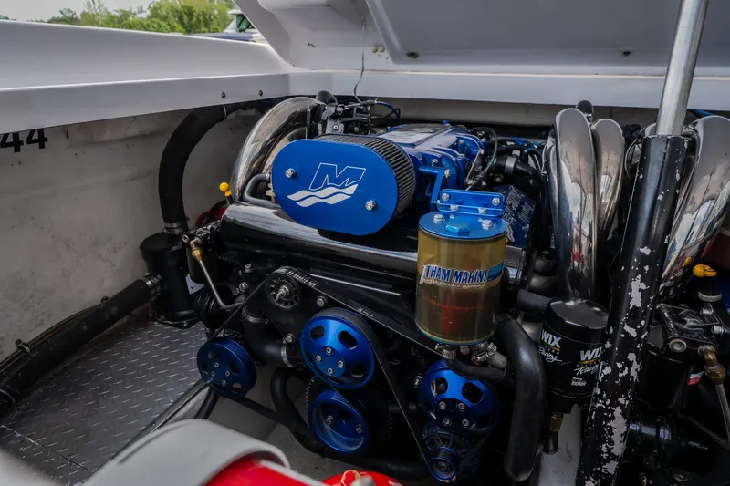 Slide: The Image of Engine compartment of a 2005 Donzi 35 ZR boat, featuring a powerful marine engine. - 36