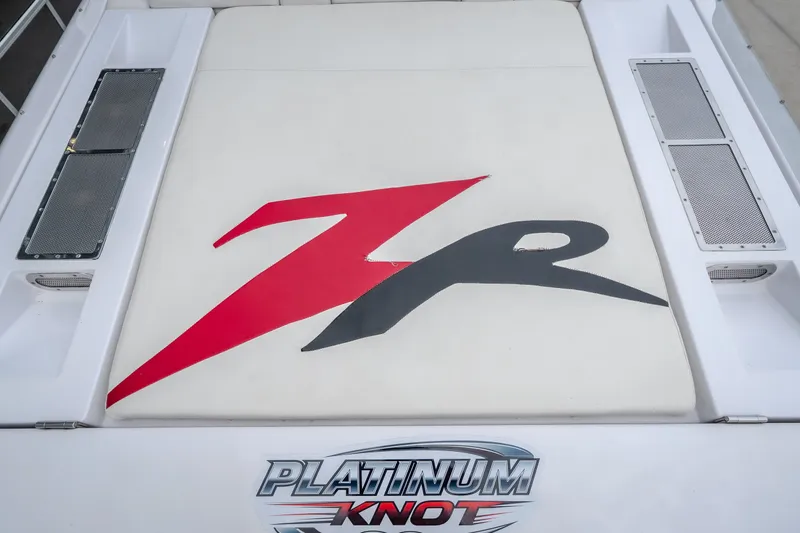 Slide: The Image of 2005 Donzi 35 ZR boat with bold red and black logo on white surface. - 18