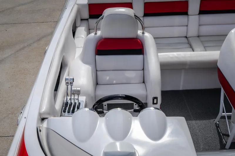 Slide: The Image of Interior of a 2005 Donzi 35 ZR boat with white and red seating. - 10