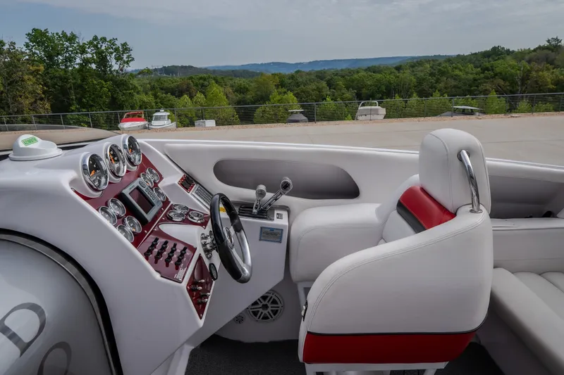 Slide: The Image of Cockpit of a 2005 Donzi 35 ZR boat with white and red seating. - 22