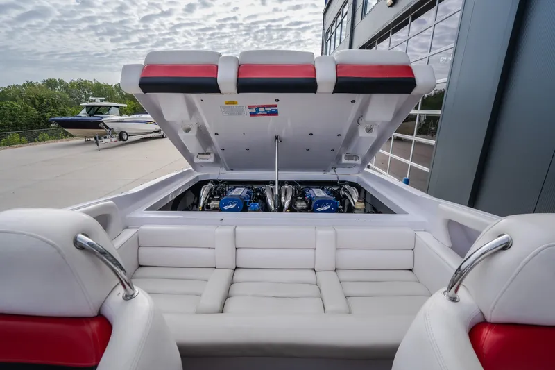 Slide: The Image of 2005 Donzi 35 ZR boat engine compartment with open hatch, showcasing dual engines. - 33