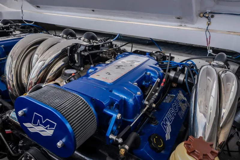 Slide: The Image of Engine of a 2005 Donzi 35 ZR boat, featuring Mercury Racing components. - 38