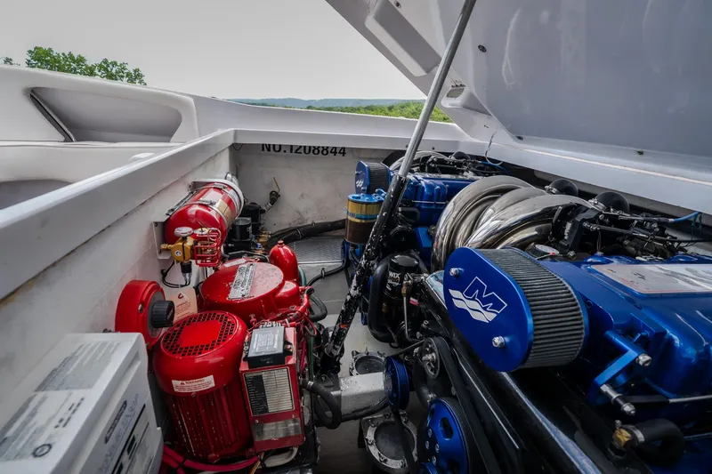 Slide: The Image of Engine compartment of a 2005 Donzi 35 ZR boat with visible machinery and components. - 39