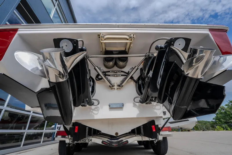 Slide: The Image of Rear view of a 2005 Donzi 35 ZR boat showing dual propellers and outboard motors. - 14