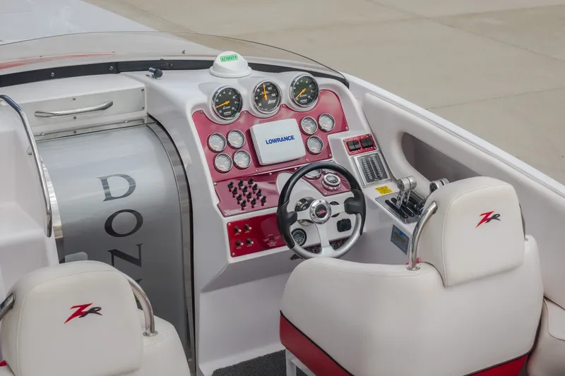Slide: The Image of Cockpit of 2005 Donzi 35 ZR boat with steering wheel and control panel. - 55