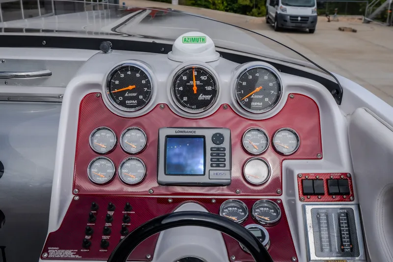 Slide: The Image of Dashboard of a 2005 Donzi 35 ZR boat with gauges and navigation system. - 26