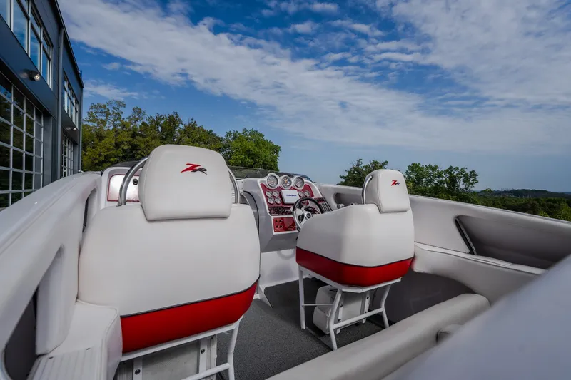 Slide: The Image of 2005 Donzi 35 ZR boat interior with white and red seating, dashboard view. - 20