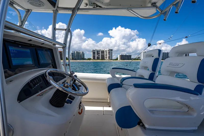 Slide: The Image of 2006 Boston Whaler 320 Outrage interior with ocean view and modern dashboard. - 40