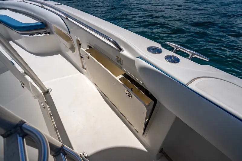 Slide: The Image of 2006 Boston Whaler 320 Outrage boat interior with open storage compartment. - 36