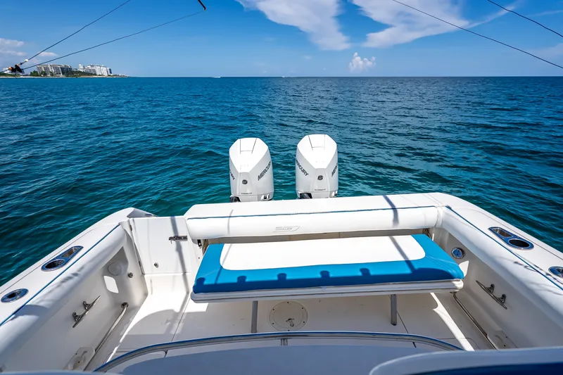 Slide: The Image of 2006 Boston Whaler 320 Outrage boat with twin Mercury engines on open sea. - 44