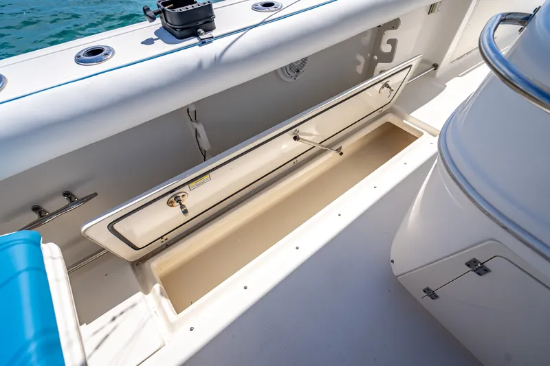 Slide: The Image of Open storage compartment on 2006 Boston Whaler 320 Outrage boat deck. - 60