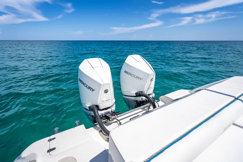 Slide: The Image of 2006 Boston Whaler 320 Outrage with twin Mercury engines on open sea. - 63