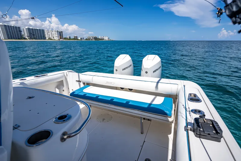 Slide: The Image of 2006 Boston Whaler 320 Outrage boat on ocean, with twin Mercury engines. - 45