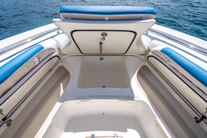 Slide: The Image of 2006 Boston Whaler 320 Outrage boat interior with open storage compartment. - 33