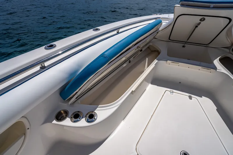Slide: The Image of 2006 Boston Whaler 320 Outrage boat interior with storage compartments and seating. - 31