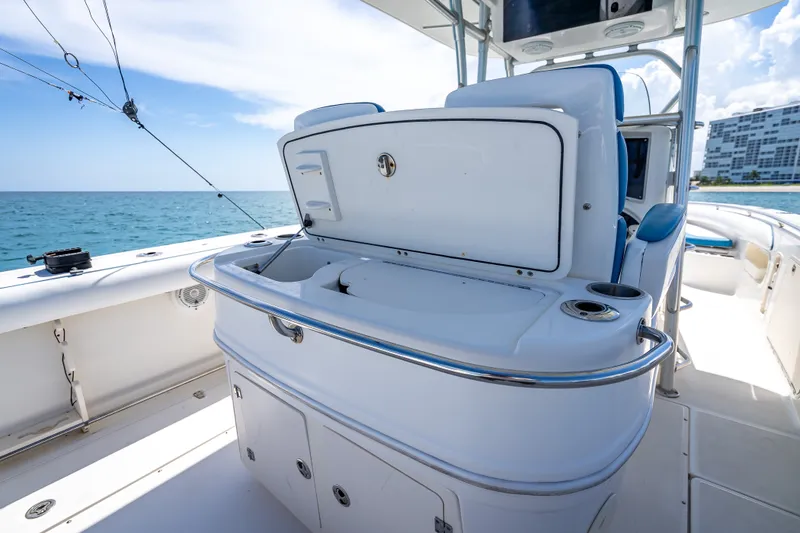 Slide: The Image of 2006 Boston Whaler 320 Outrage boat interior with fishing equipment and ocean view. - 59