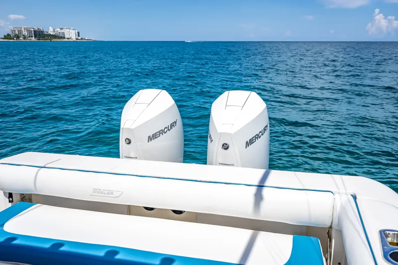 Slide: The Image of 2006 Boston Whaler 320 Outrage with twin Mercury engines on open sea. - 47