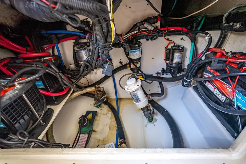Slide: The Image of Electrical and mechanical components inside a 2006 Boston Whaler 320 Outrage boat. - 25