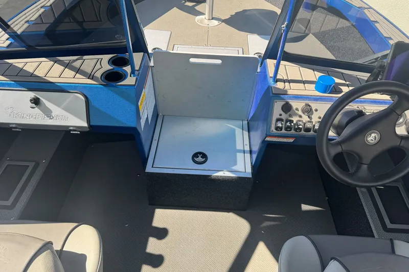 Slide: The Image of Interior view of 2023 KingFisher 1825 Warrior Sport boat cockpit with steering wheel. - 20