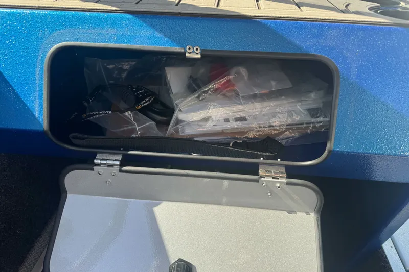 Slide: The Image of Storage compartment of 2023 KingFisher 1825 Warrior Sport boat, containing accessories. - 27