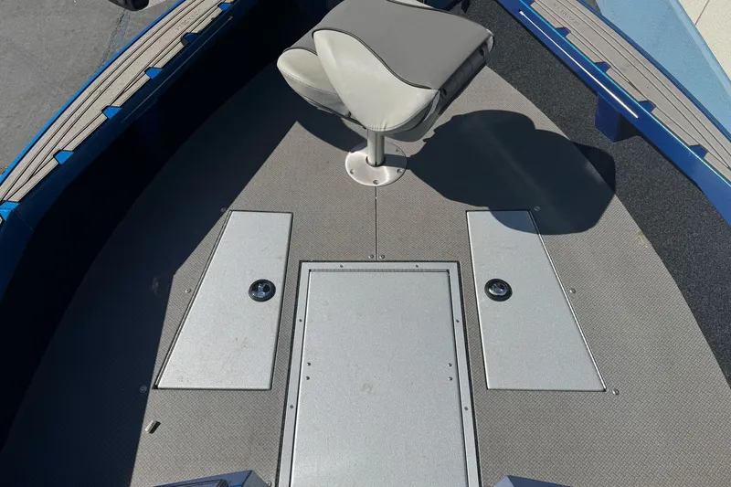 Slide: The Image of 2023 KingFisher 1825 Warrior Sport boat interior with seating and storage compartments. - 21