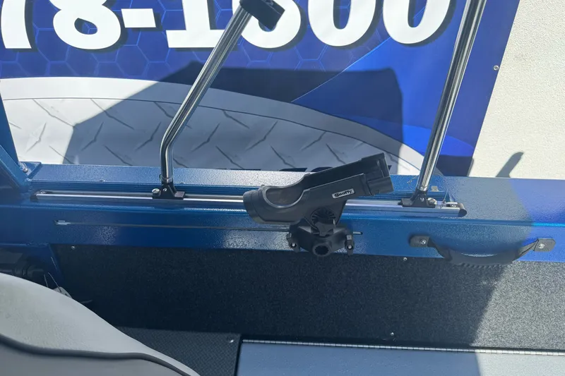 Slide: The Image of 2023 KingFisher 1825 Warrior Sport boat interior with rod holder and blue accents. - 15
