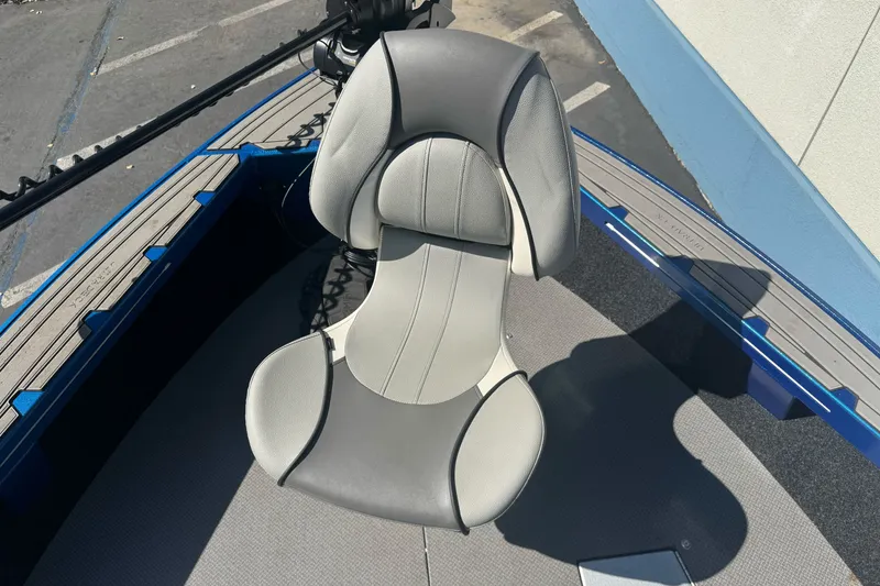 Slide: The Image of 2023 KingFisher 1825 Warrior Sport boat seat, gray and white, on deck. - 23