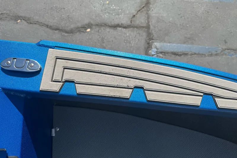 Slide: The Image of Close-up of 2023 KingFisher 1825 Warrior Sport boat deck detail in blue. - 29