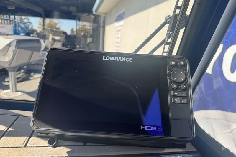 Slide: The Image of Lowrance HDS9 fishfinder on 2023 KingFisher 1825 Warrior Sport boat dashboard. - 18