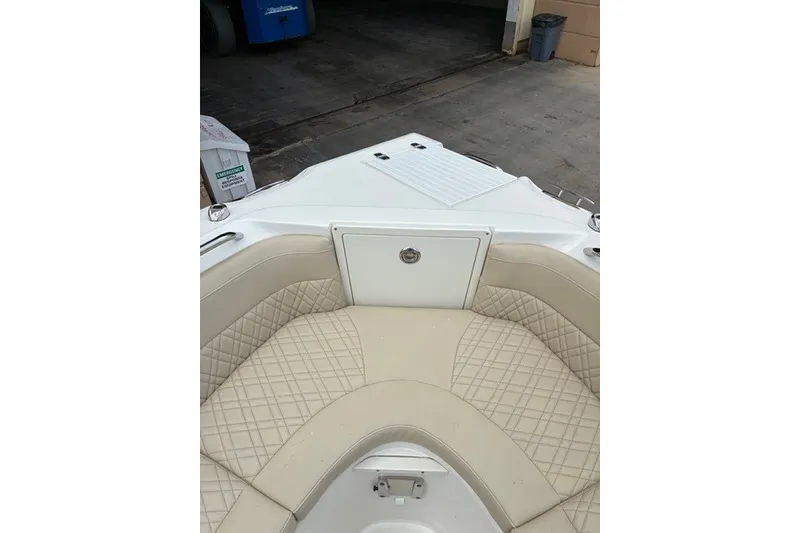 Slide: The Image of 2021 Century 24 Resorter boat interior with beige quilted seating. - 30