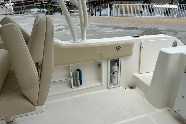 Slide: The Image of 2021 Century 24 Resorter boat interior with beige seating and storage compartments. - 41