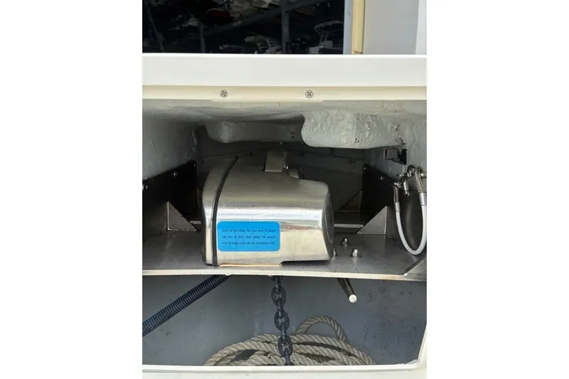 Slide: The Image of Anchor compartment of 2021 Century 24 Resorter boat with chain and rope. - 58